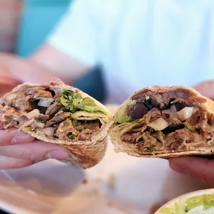 Carne Asada burrito: note - bigger in person. No rice and no sour cream as we requested