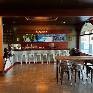 Inside facing the entrance and hanging TVs.