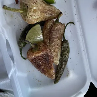 a person holding a container of food