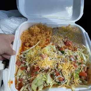 a person holding a container of food