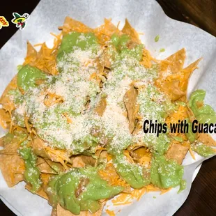 Chips with Guacamole: Tortilla Chips with Guacamole , Cheddar Cheese and Añejo Cheese.