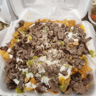 Carne Asada Chips ($14.99):  a huge portion for sharing.  Lacking shredded cheese &amp; needs more cotija cheese, but still tasty, 8/10 rating.