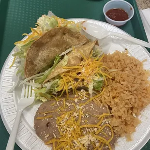 2 hard shell tacos with rice and beans