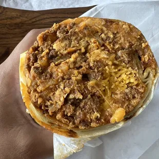 half of a chorizo breakfast burrito