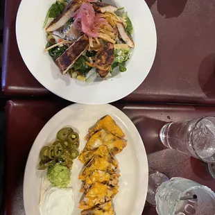 Blackened chicken salad and combo nachos.