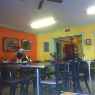 a restaurant with tables and chairs