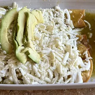 Flautas Ahogadas - 3 rolled-up crunchy 14&quot; tortillas filled w shredded chicken - green tomatillo sauce, sour cream, queso fresco &amp; avocado