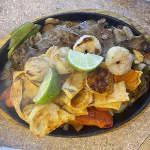 Mixed Fajitas - a good amount of Shrimp, Steak and Chicken, plus tasty onions, peppers and mushrooms (hate mushrooms).