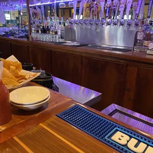 a bar with a variety of drinks