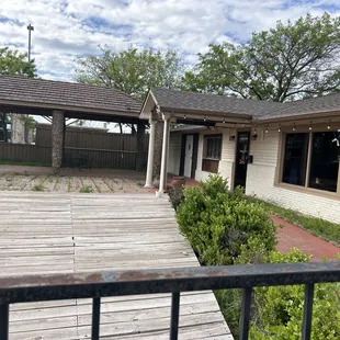 Dilapidated patio and odd wooden stage
