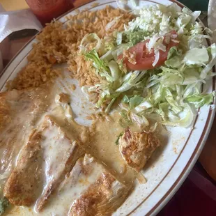 Grilled chicken with cheese and rice.