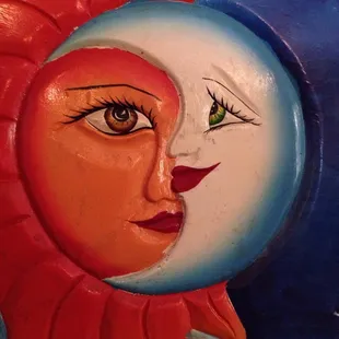 the face of a sun and moon