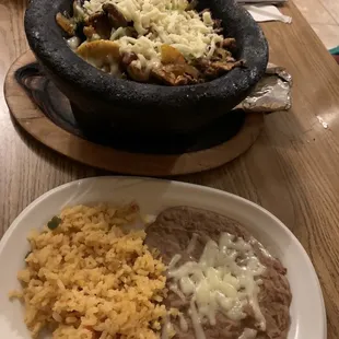 El TIO JUAN SPECIAL, beef steak, shrimp, vegetables with cheese in hot stone bowl. Rice, beans and a hot tortilla included.