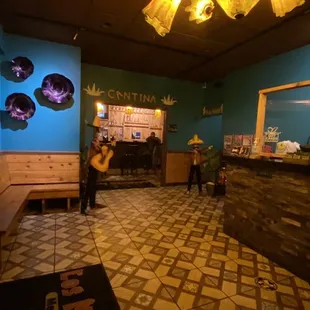 a woman standing in the bar