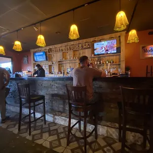 people sitting at the bar