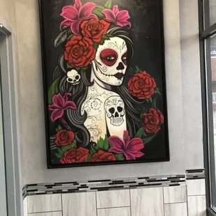 a painting of a woman with roses