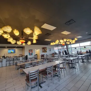 Clean dining room. Airey with lighting and lots of windows