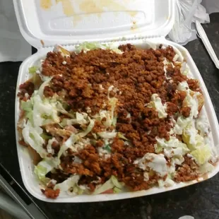 NACHOS w/chorizo! I wasn&apos;t that hungry so I got nachos... not expecting this hugeness! They heated up well! Turned into a Mexican lasagna!