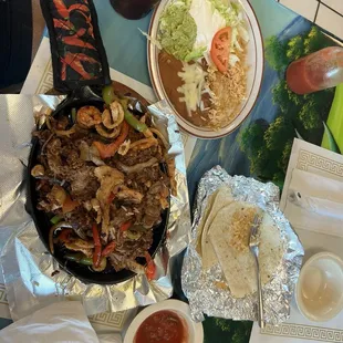 My Fajita, the accompanying dishes, and sauces.