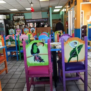 brightly painted chairs and tables