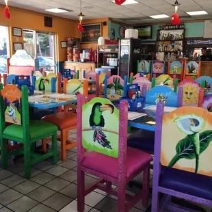 brightly painted chairs and tables