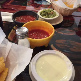 The chips salsa, guac and cheese queso