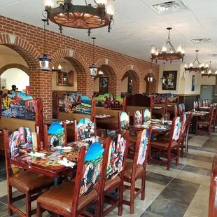 a dining area with tables and chairs