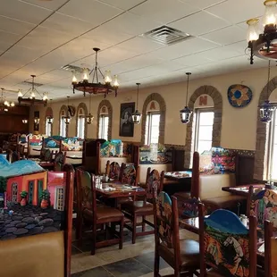 a dining area with tables and chairs