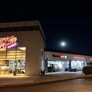 Outside with the OLD sign still up. A full moon and tranquil kind of day.