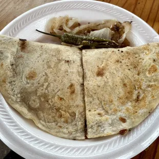 wo tortillas on a paper plate