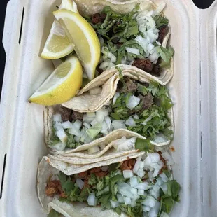 Al pastor, Carne asada, and chorizo tacos
