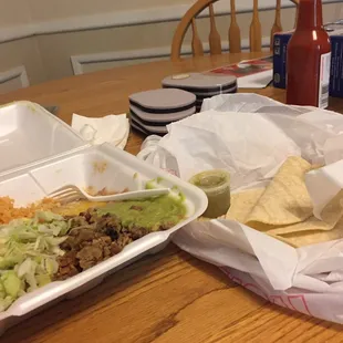 two takeout containers of food