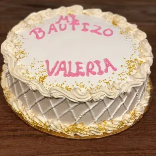 a white cake with pink writing