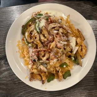 Baha chicken with peppers and onions