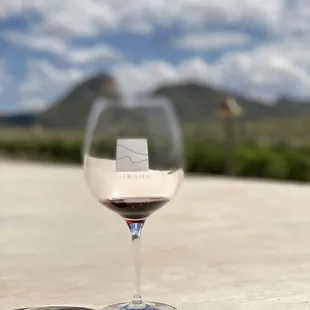 a glass of wine on a table