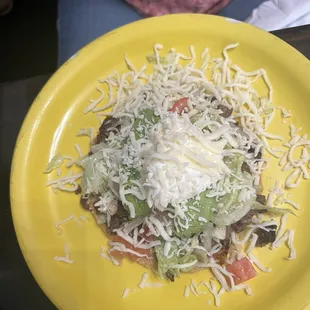 Steak tostada with guacamole for a buck. Worth it!