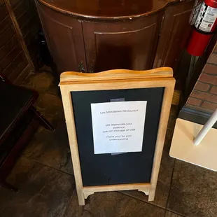 Wait sign at the front entrance
