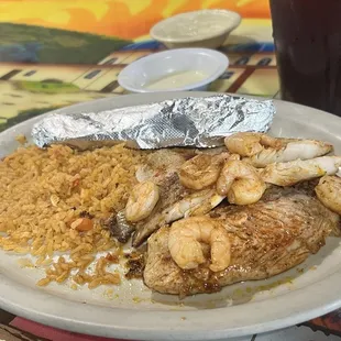 Tilapia with shrimp and Mexican rice.