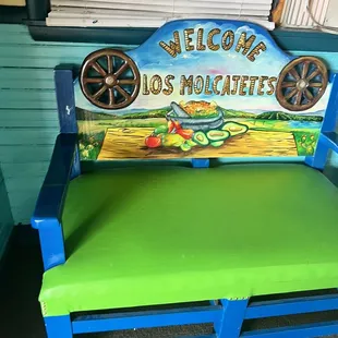a painted bench with wheels