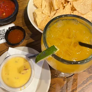 Queso and mango margarita on the rocks