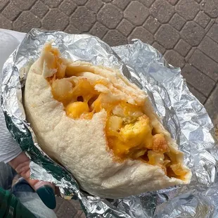 a burrito wrapped in aluminum foil