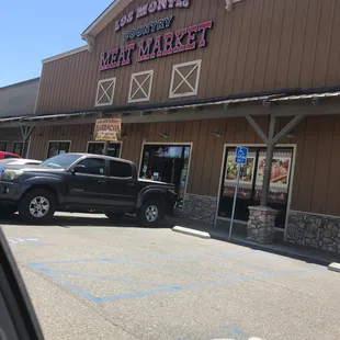 a truck parked in front of the store