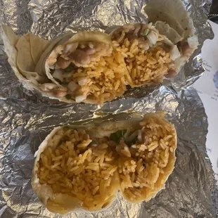 two burritos filled with rice
