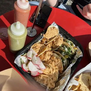 a plate of tacos and chips