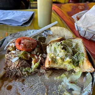 Barbacoa torta! Not even halfway in. Delish! Filling! Packed with tender meat and avocados!