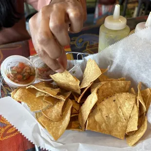 Homemade tortilla chips and salsa come with tacos