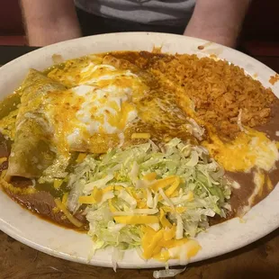 Shredded beef, cheese, chili con carne enchiladas, rice and beans