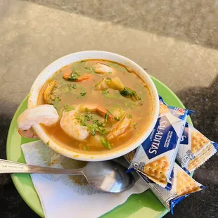 a bowl of soup and crackers