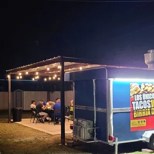 a food truck in a backyard