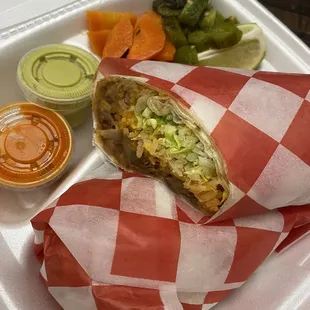 Burrito normally comes with choice of meat, rice, cheese, lettuce, cilantro, onions and sour cream